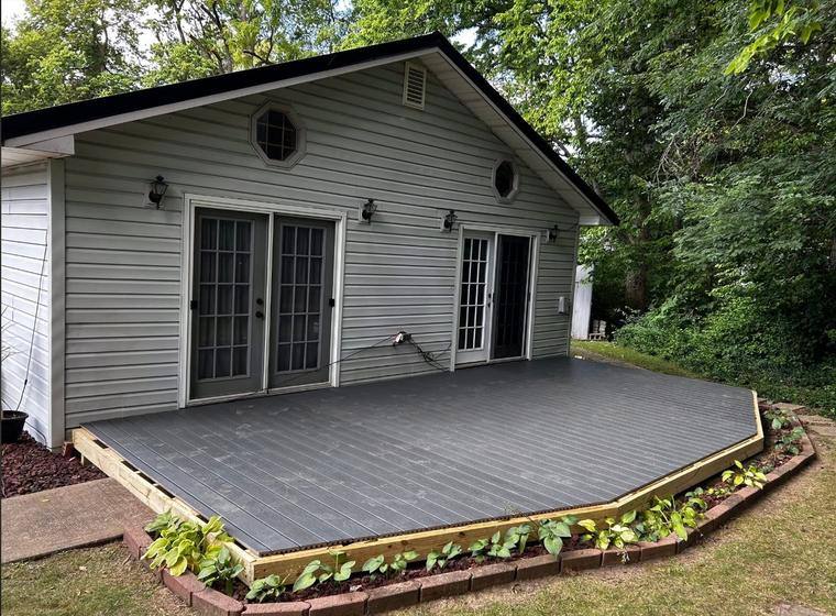 Finished composite deck with landscaped border