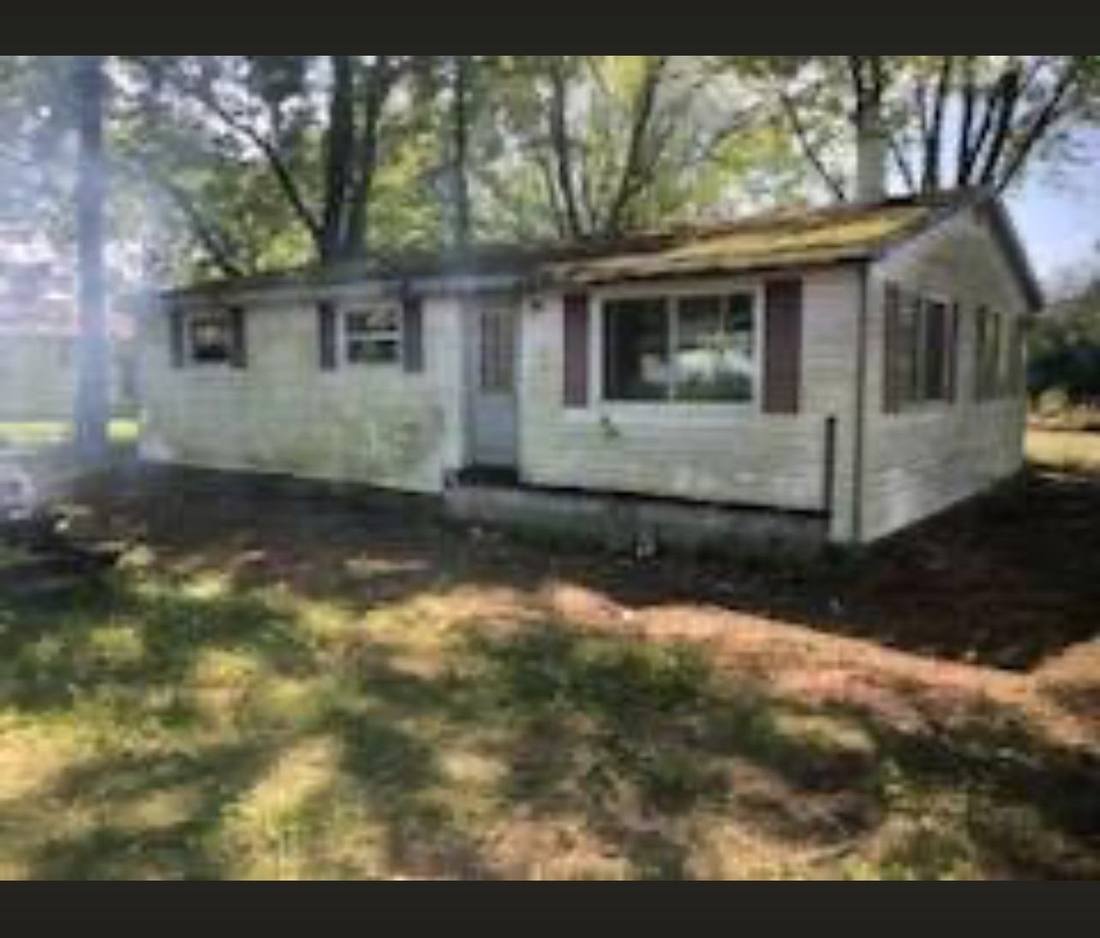 Neglected single-story home before renovation