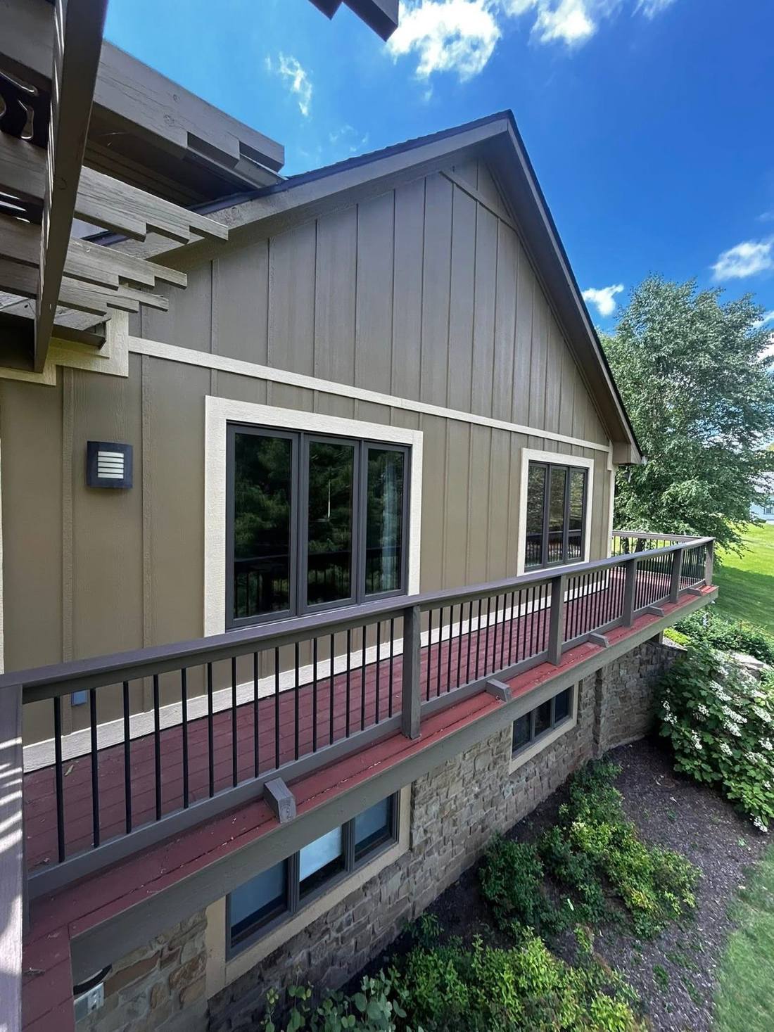 New board-and-batten siding and railing installed by Marcum Construction