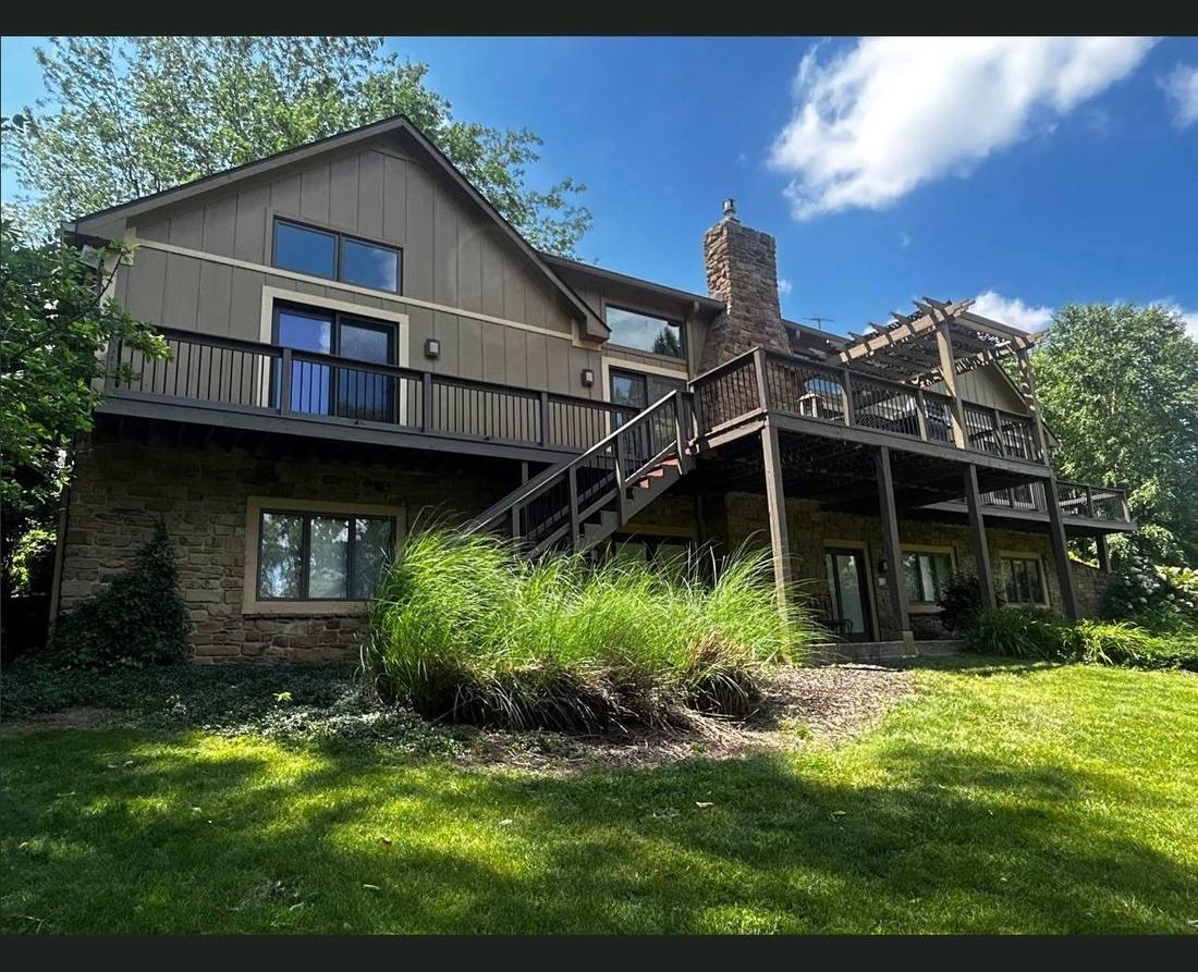 Same home after Marcum Construction installed new siding and repaired the deck