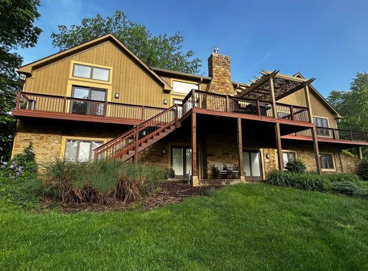 Before: original siding and weathered deck