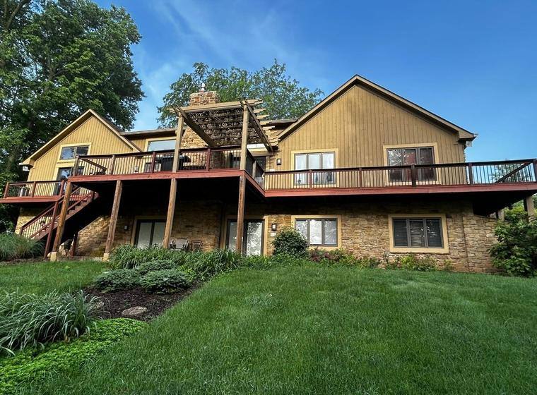 Before: the original tan siding, side elevation