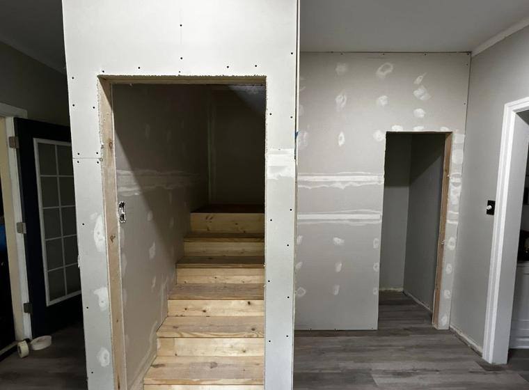Drywall hung around the new stairwell