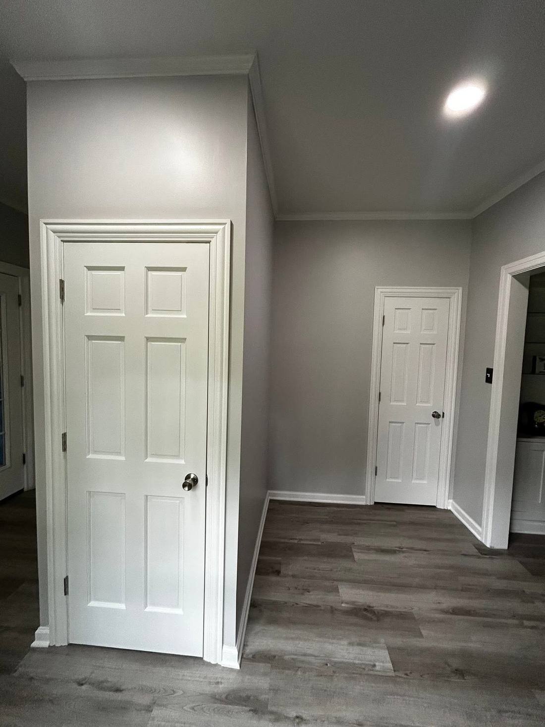 The same stairwell finished with drywall, trim and a door